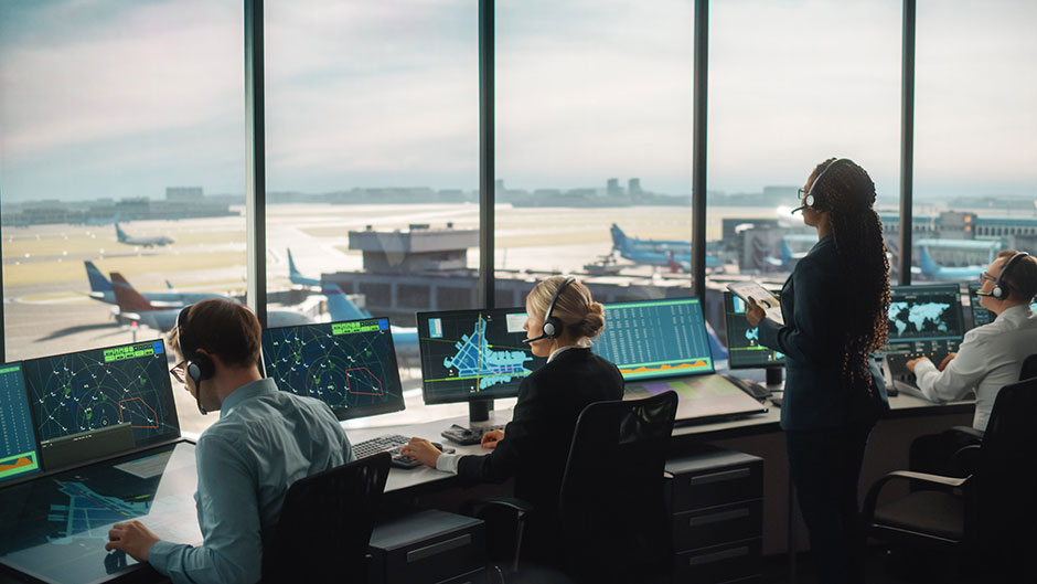 three workers in aviation tower